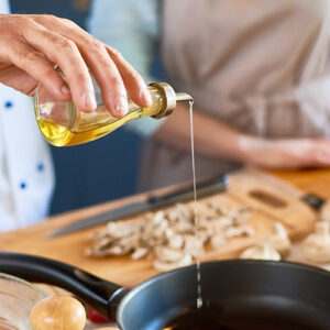 Close Up Chefs Stove And Hands