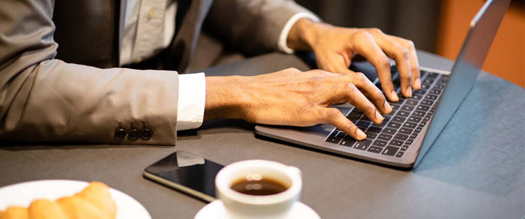 Close Up Of A Laptop With Coffee