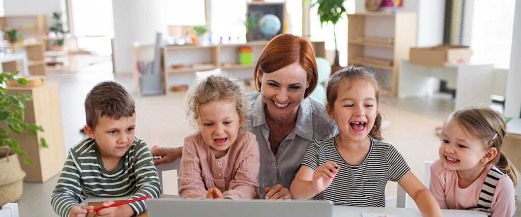 Kids With Teacher At Daycare