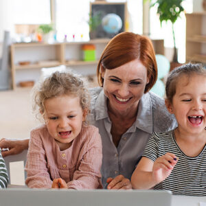 Kids With Teacher At Daycare