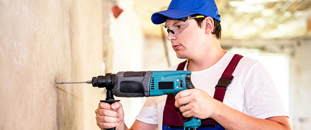 Man Using Compact Drill