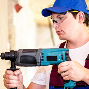 Man Using Compact Drill