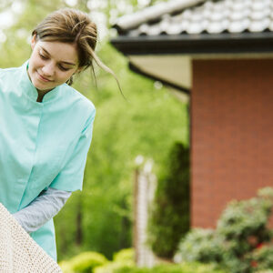 Senior At Home With Nurse