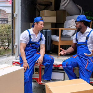 Two Movers By Their Moving Truck