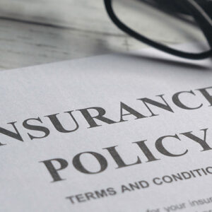 Insurance Policy On A Table