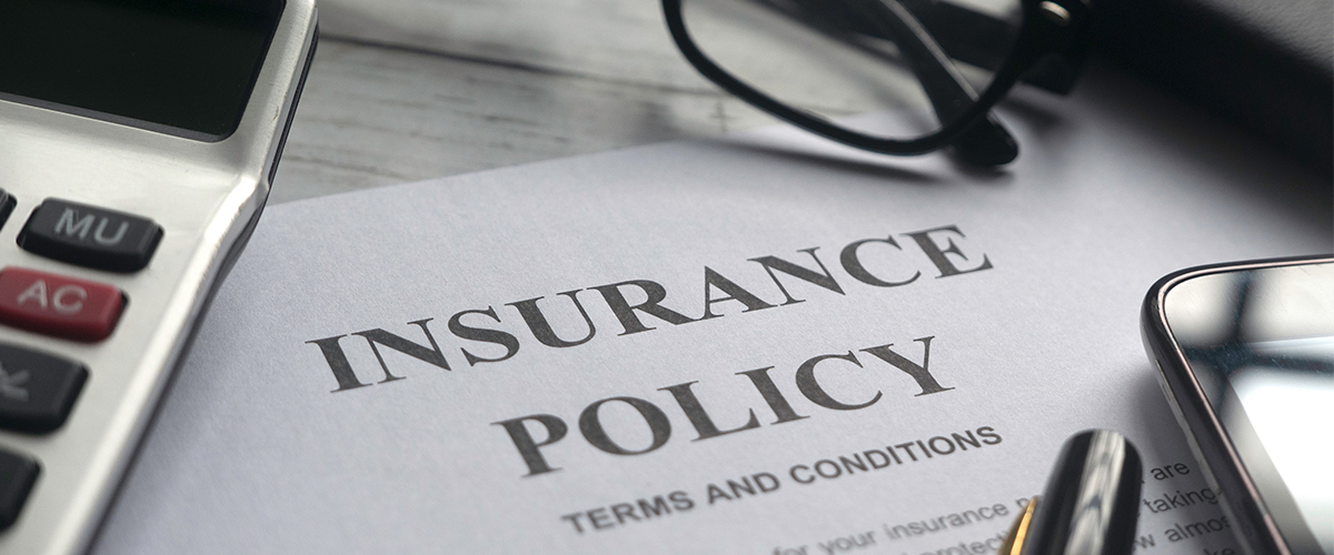 Insurance Policy On A Table