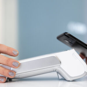 Two People Using Mobile Payment System Close Up