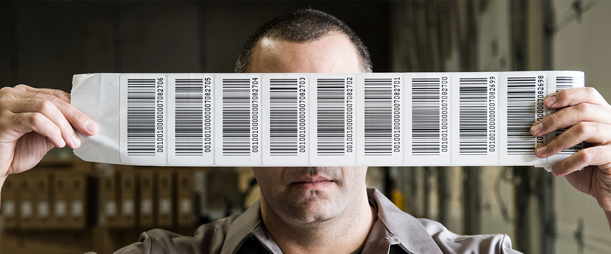 Barcode Labels Held Up By A Man