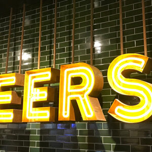 Cheers Neon Sign On A Wall