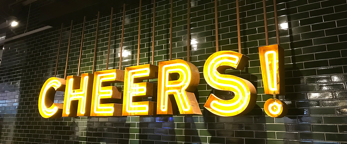 Cheers Neon Sign On A Wall